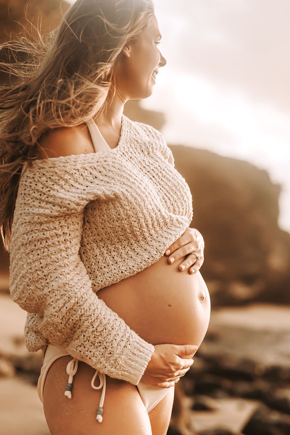 Oahu Maternity Photographer captures an expectant mother at Halona Cove beach on Oahu.