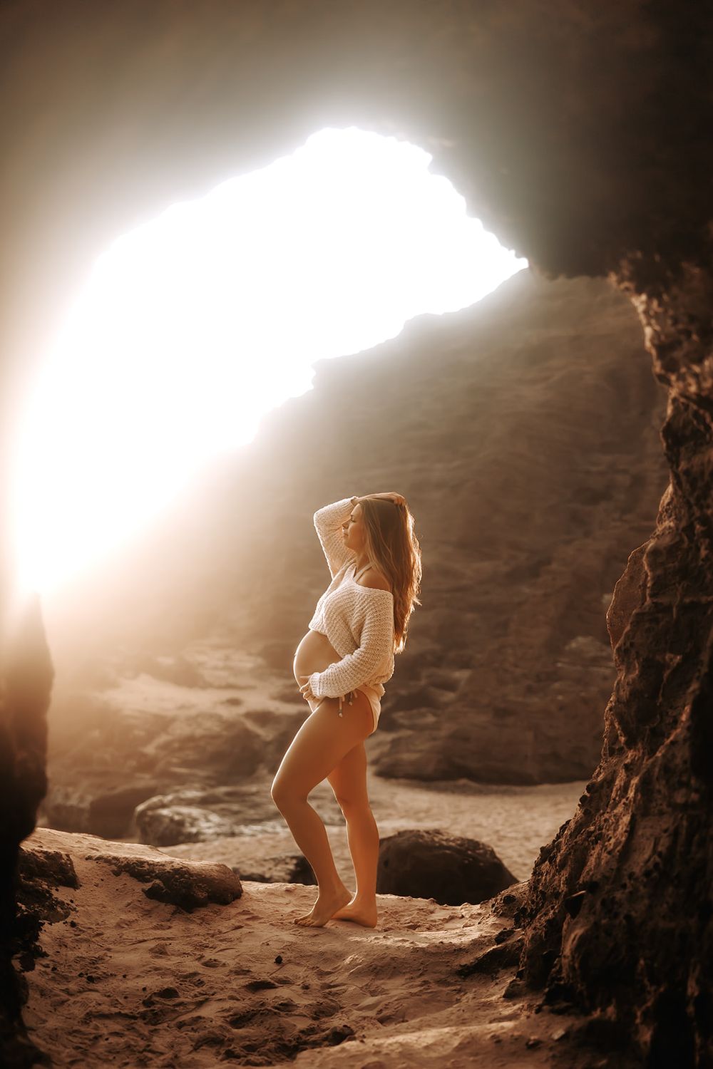 Oahu Maternity Photographer captures an expectant mother at Halona Cove lava tube on Oahu.