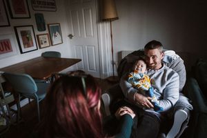 A collection of intimate indoor family moments captured in low light with warm, moody tones.