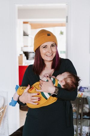A series of photos showing a person in a black sweater holding and feeding a baby wearing a yellow outfit.
