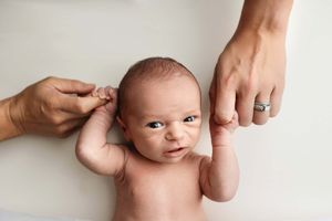 baby giving smirk during newborn session
