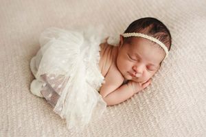 baby girl wearing tutu during newborn session