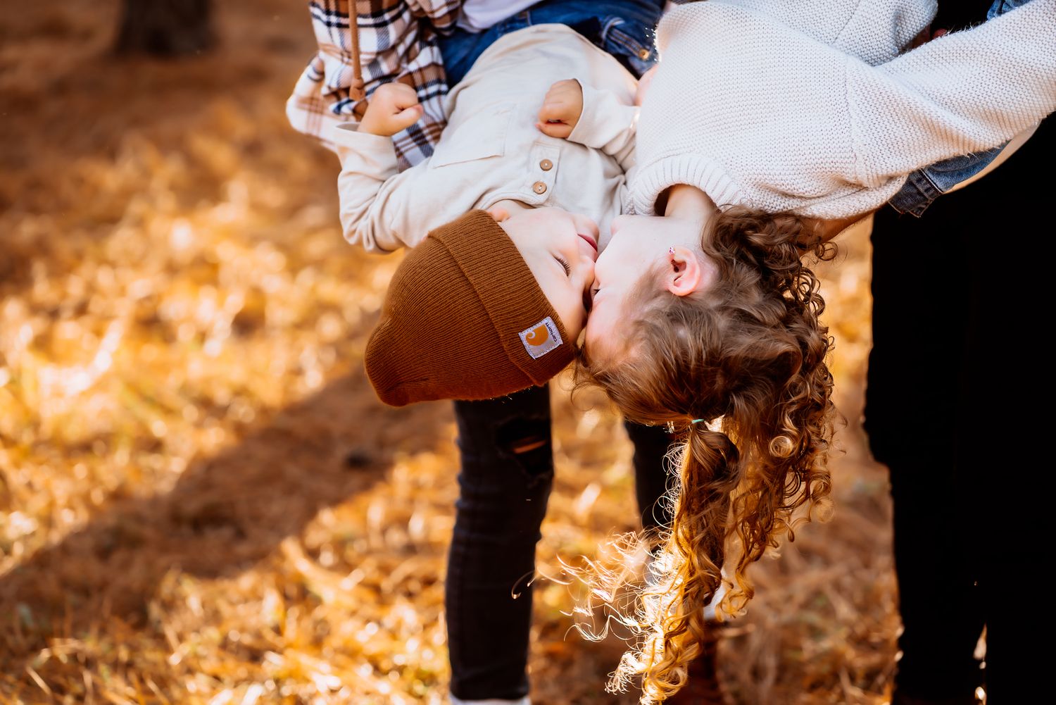 kids laughing upside down next to each other