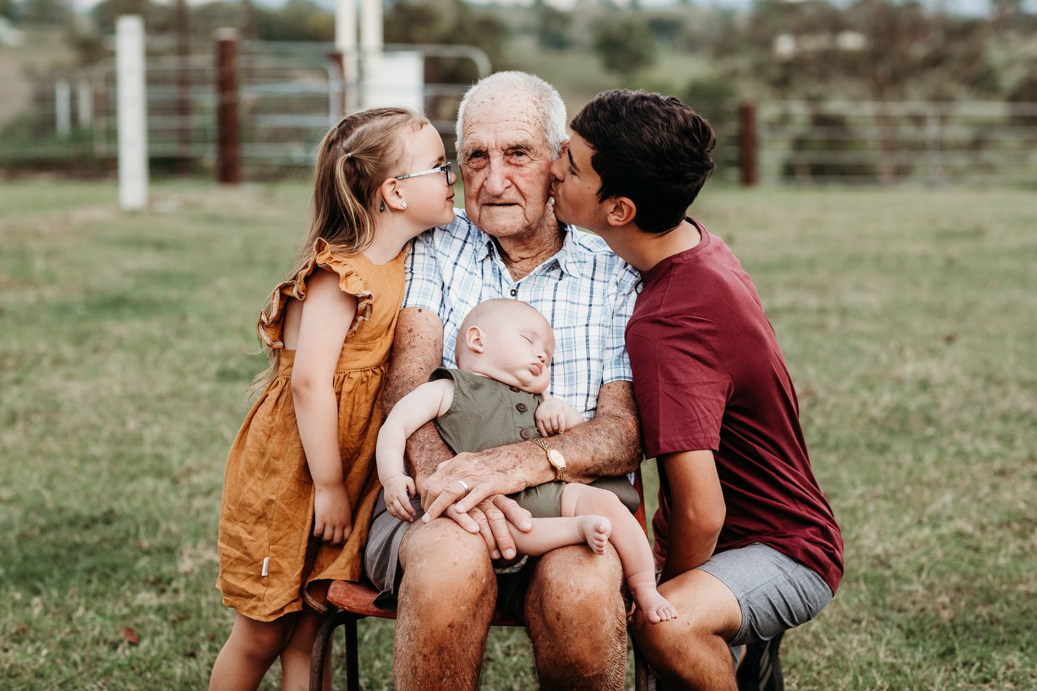 Sweet family moment shared outdoors on a sunny day.