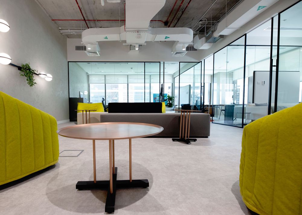 Photo of the finished work of an interior designer creating an open plan, modern-industrial office space.