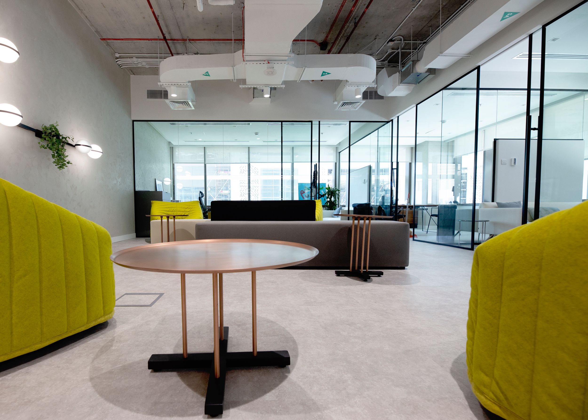 Photo of the finished work of an interior designer creating an open plan, modern-industrial office space.