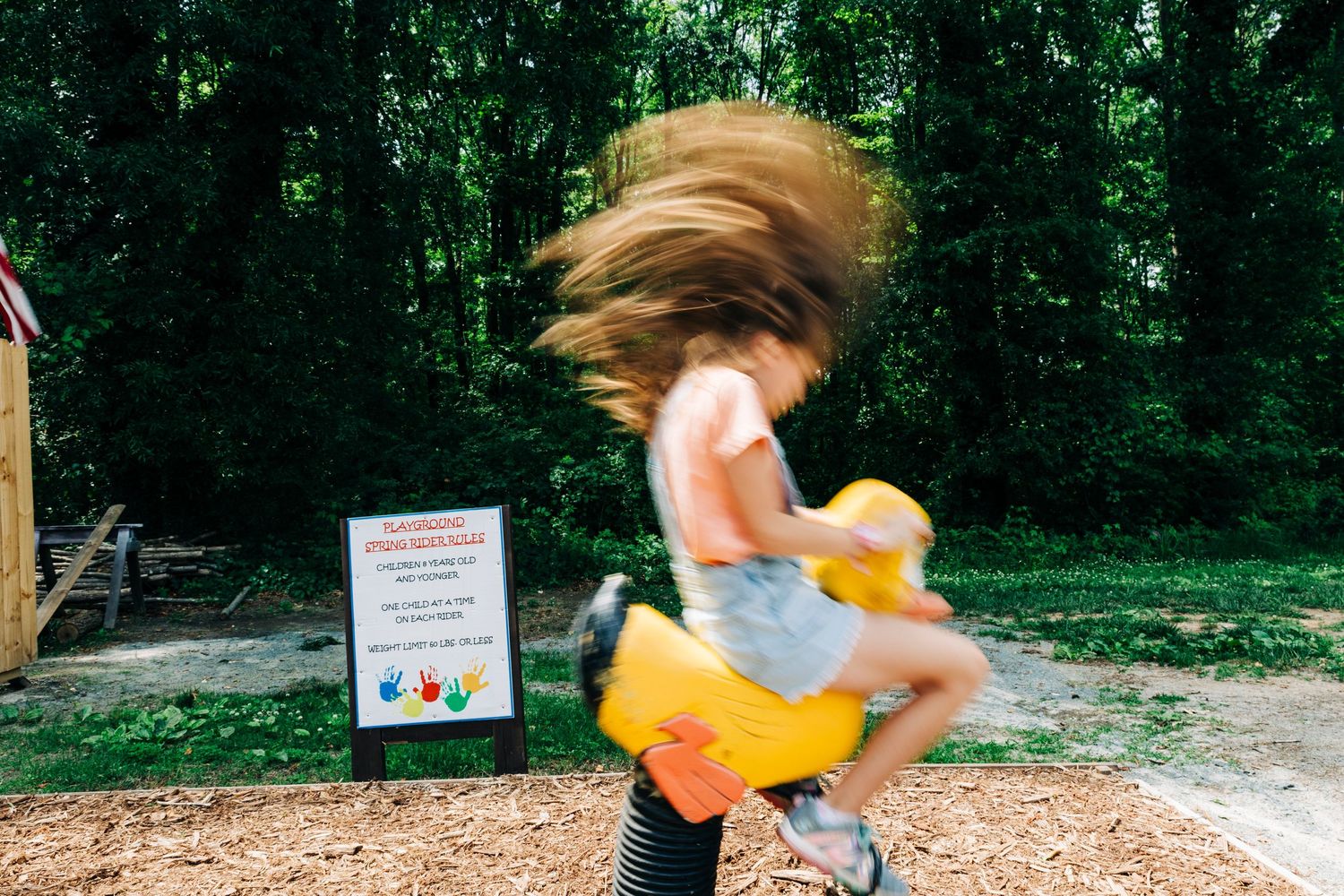 Girl playing on play equipment at Sno Ball Cabin