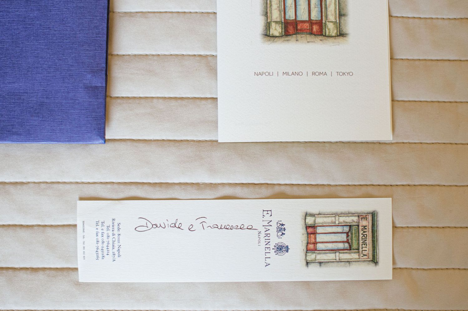 Elegant stationery and wedding invitation details in white and navy blue from E. Marinella Napoli.