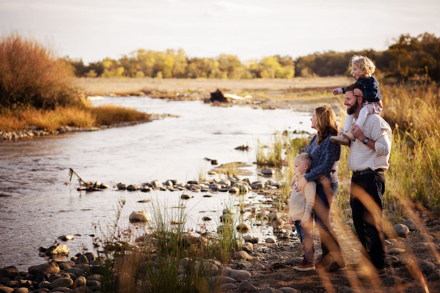 Family at sunset playing by the river, Sacramento family photographer near me, Elk Grove family photographer near me