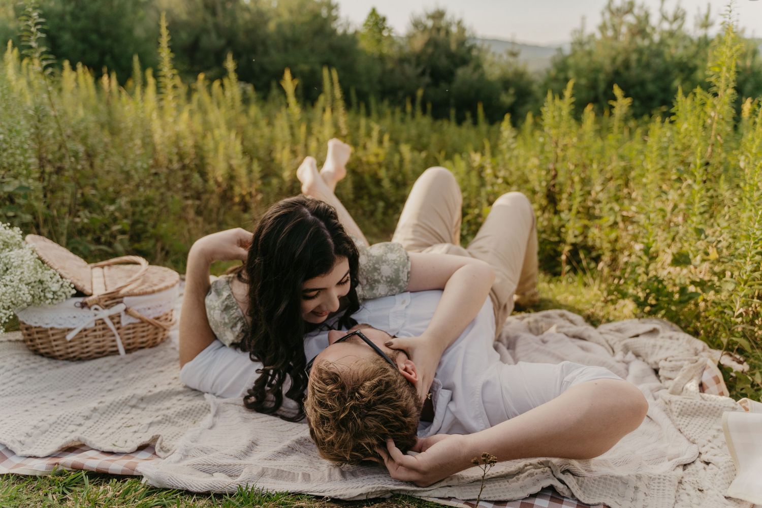 couple on a picnic in the mountains in north carolina for engagement pictures