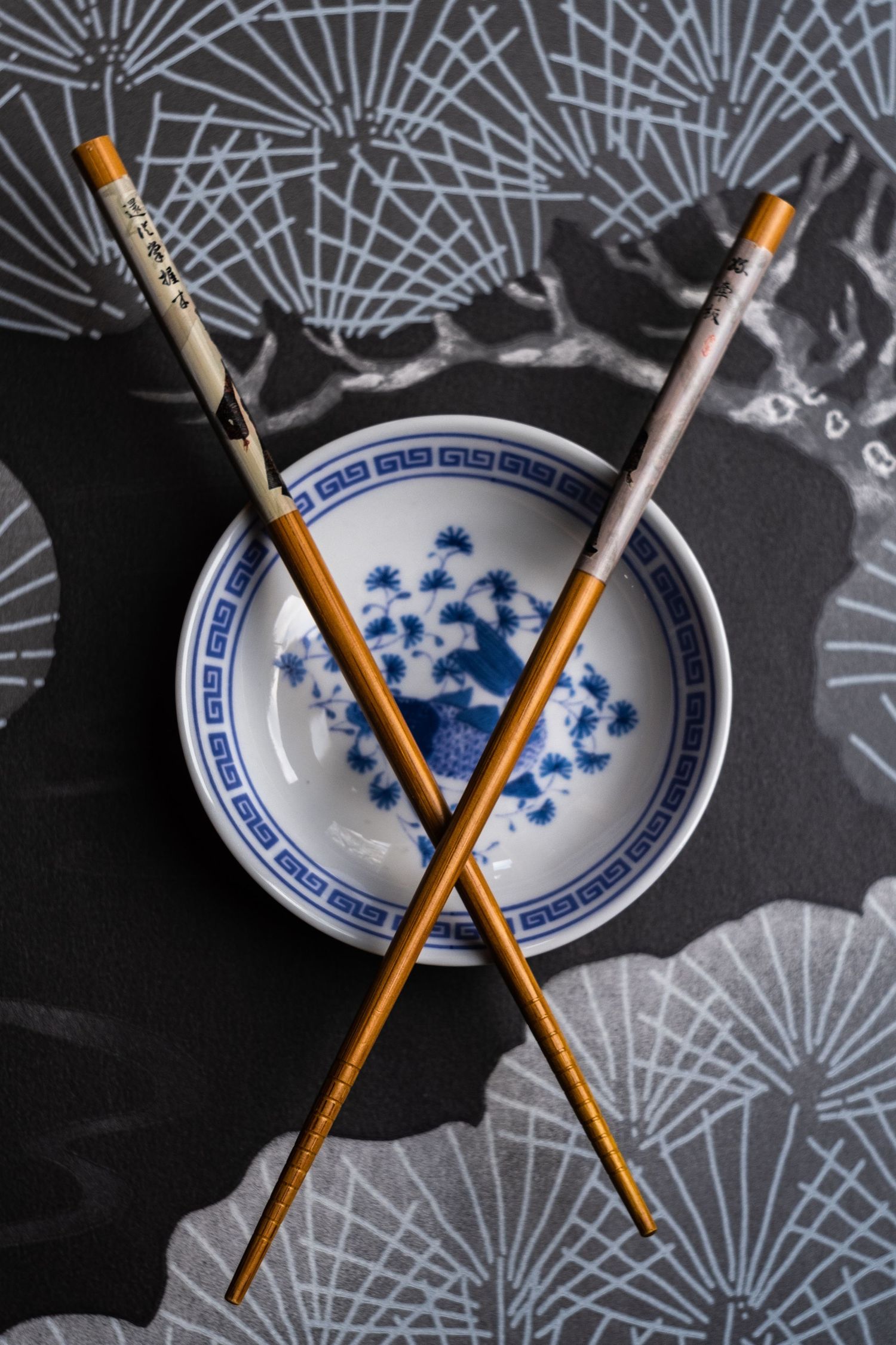 chopsticks crossed on a dish