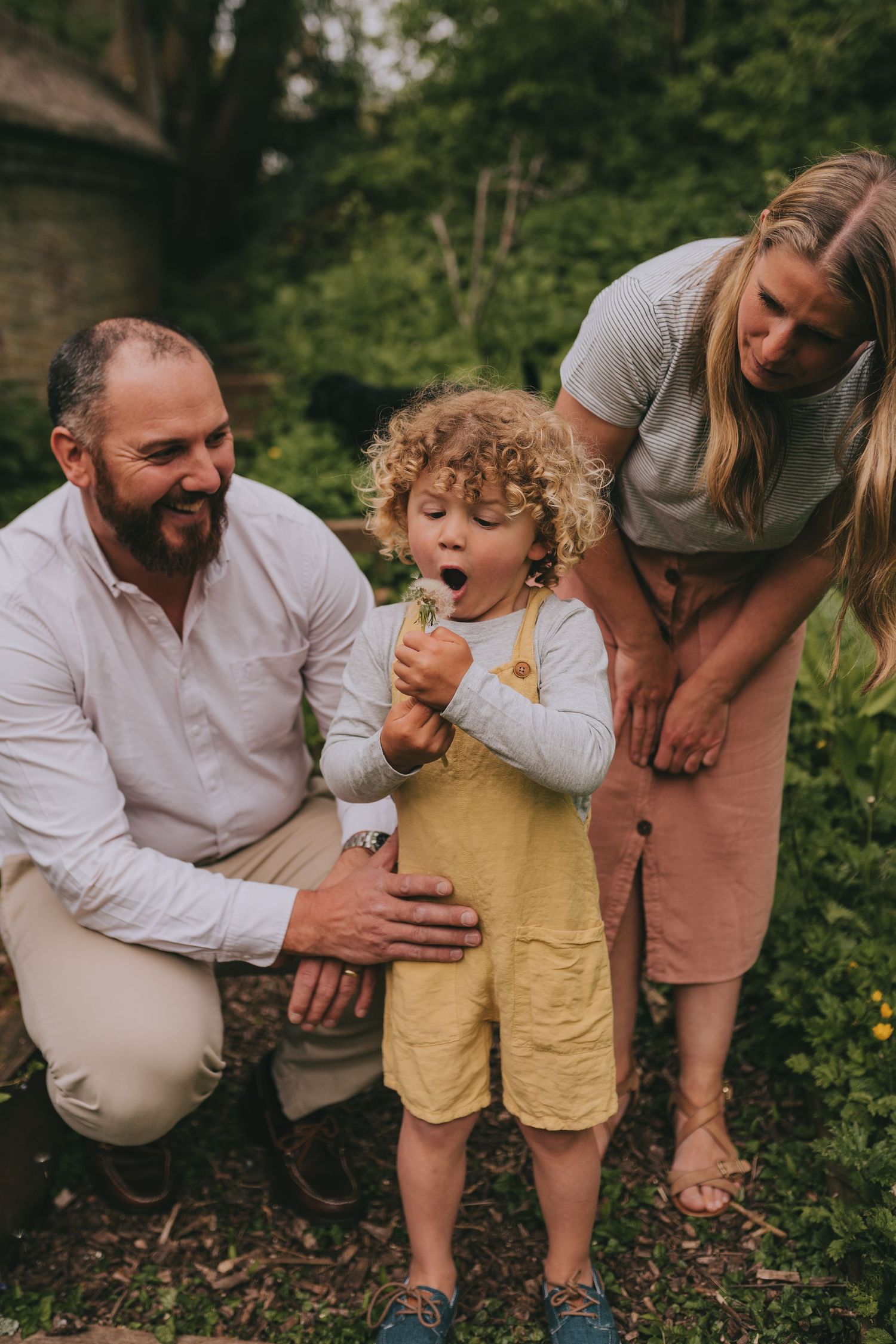 A family sharing a sweet moment outdoors while eating ice cream.