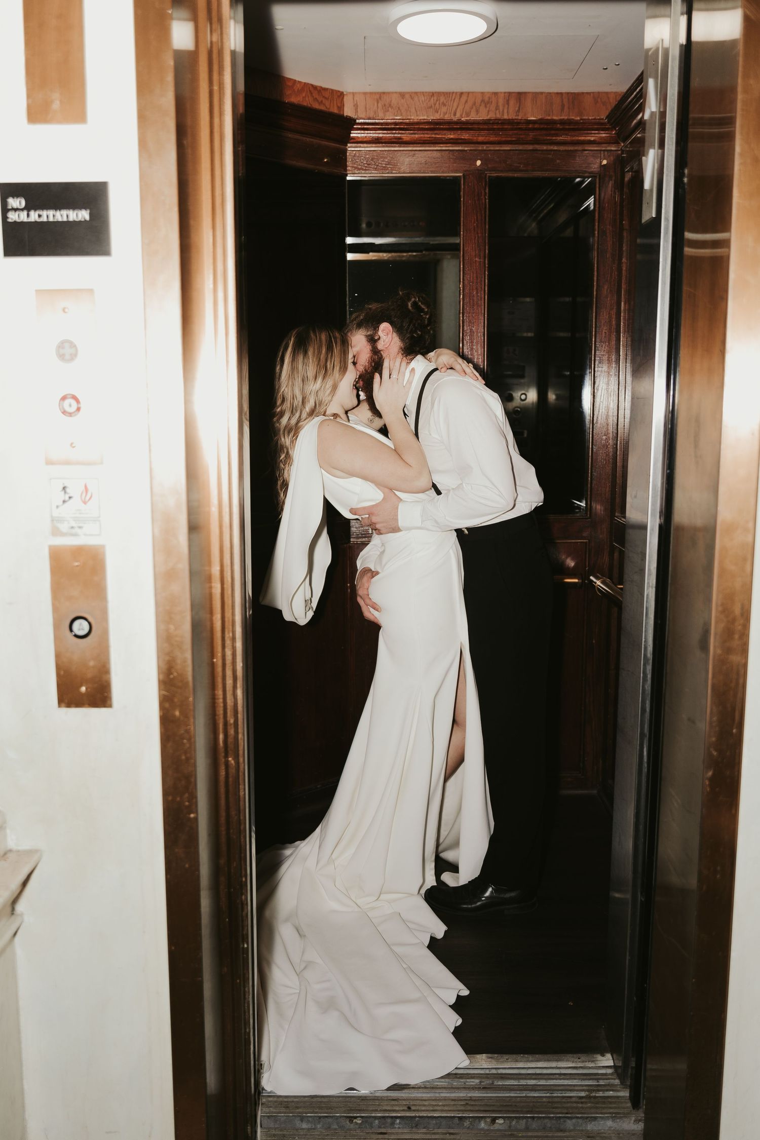 Series of candid shots showing bride in flowing white dress entering elevator.