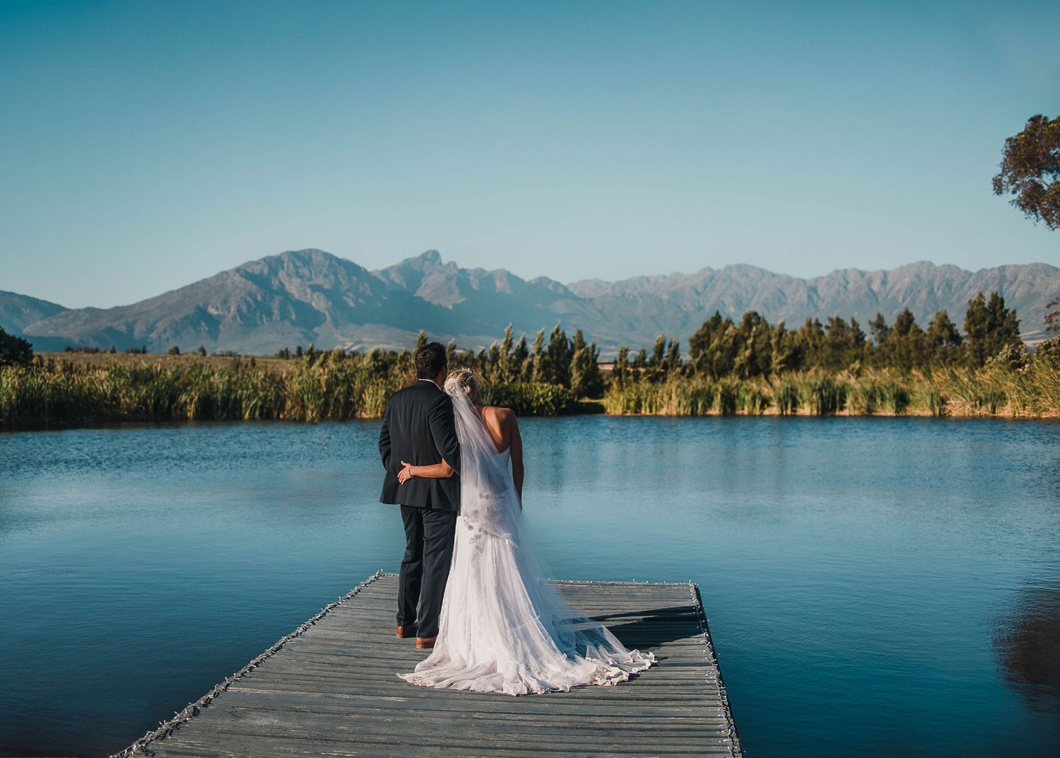 bride and groom taking in the view at their destination wedding