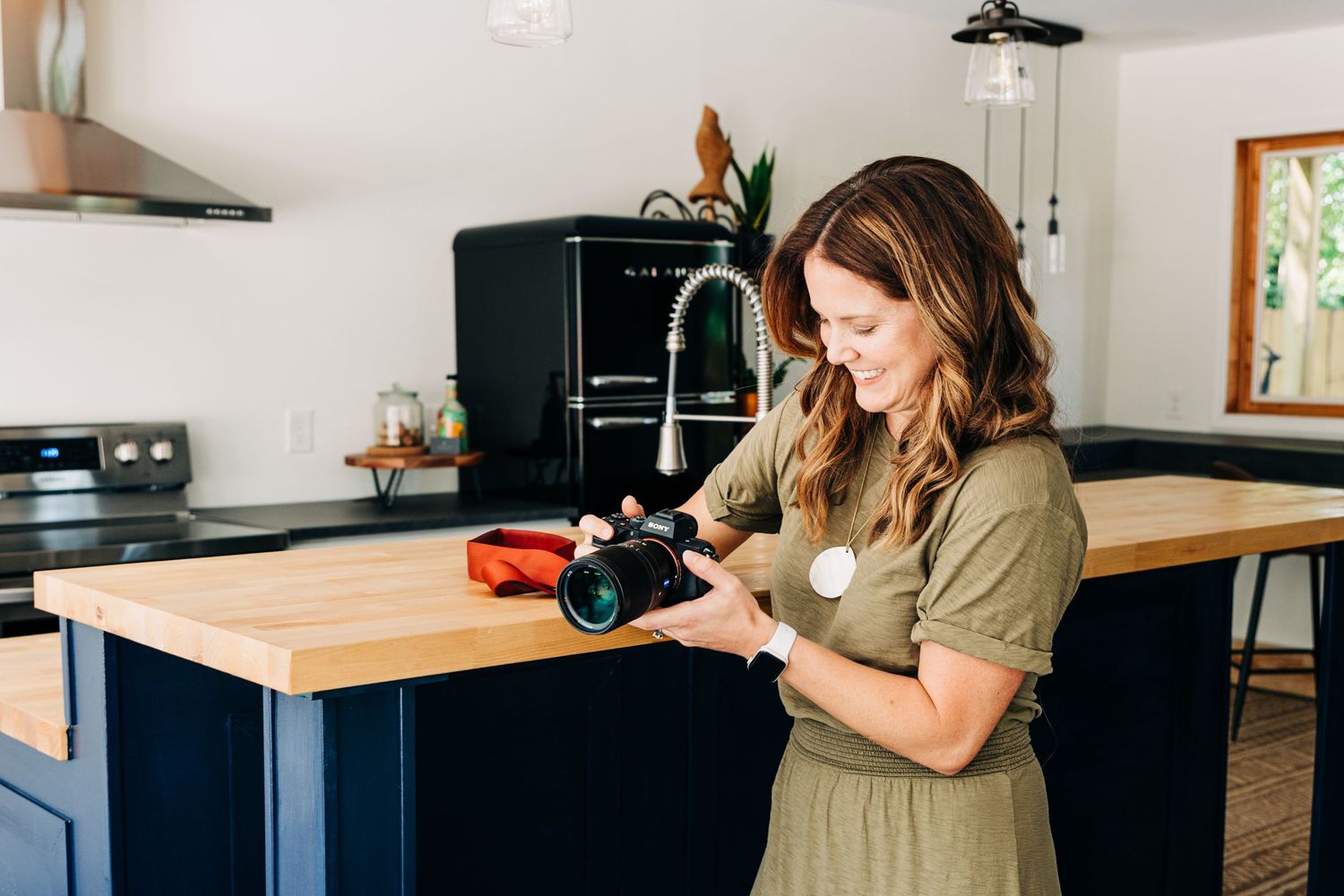 Anna Mesen Photography posing for brand photos at Little Villa Charlotte