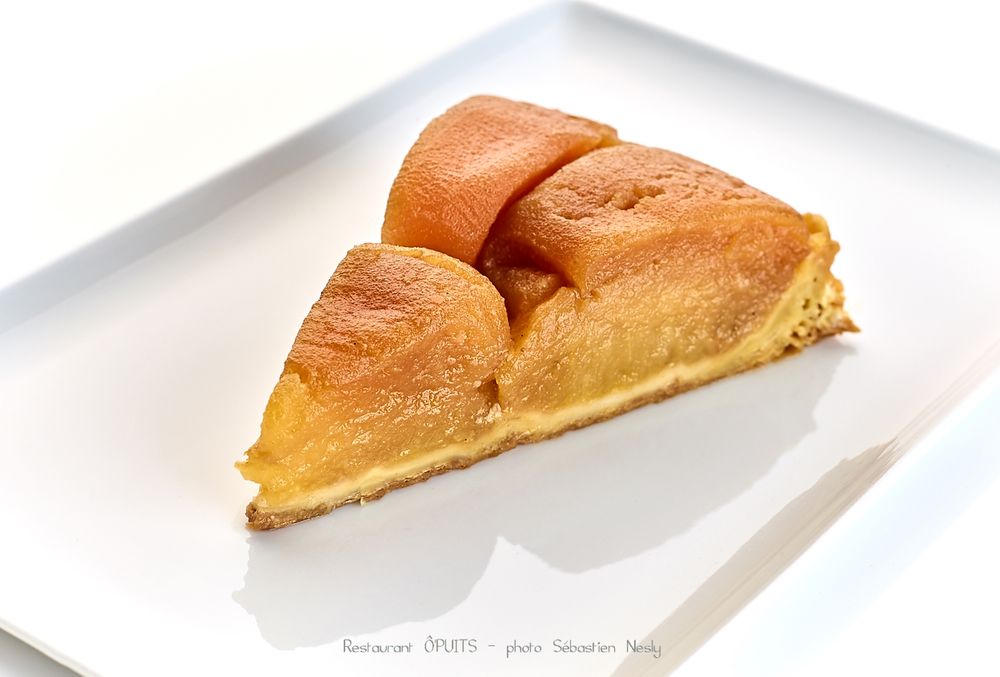 Sequence of golden brown pastries or baked goods served on white plates against a clean background.