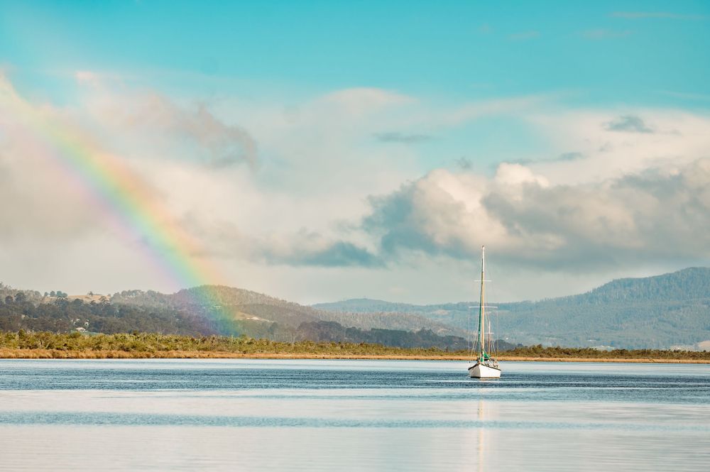 rainbow over river in franklin by Tasmanian Landscape Photographer Joss Jensen