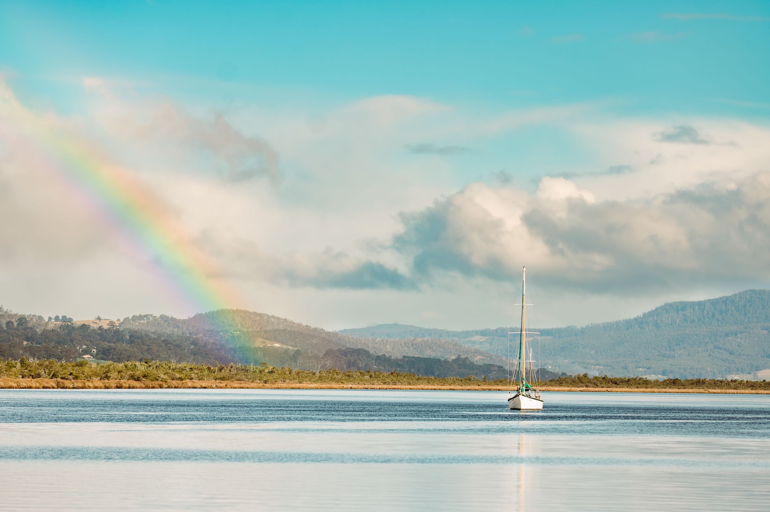 rainbow over river in franklin by Tasmanian Landscape Photographer Joss Jensen