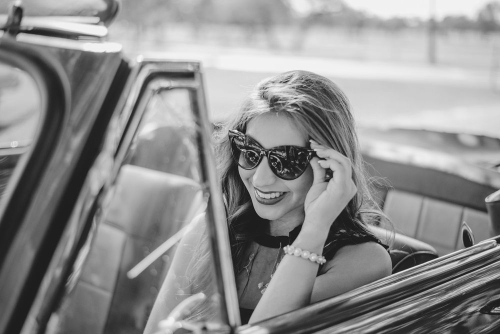 black and white. girl touching her sunglasses. Memory lane photo spot. Mission, Texas. Wedding photography