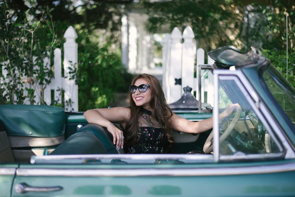 girl driving a car looking back. Memory lane photo spot. Mission, Texas. Wedding photography