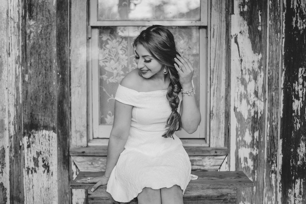 black and white girl white dress looking down. Memory lane photo spot. Mission, Texas. Wedding photography