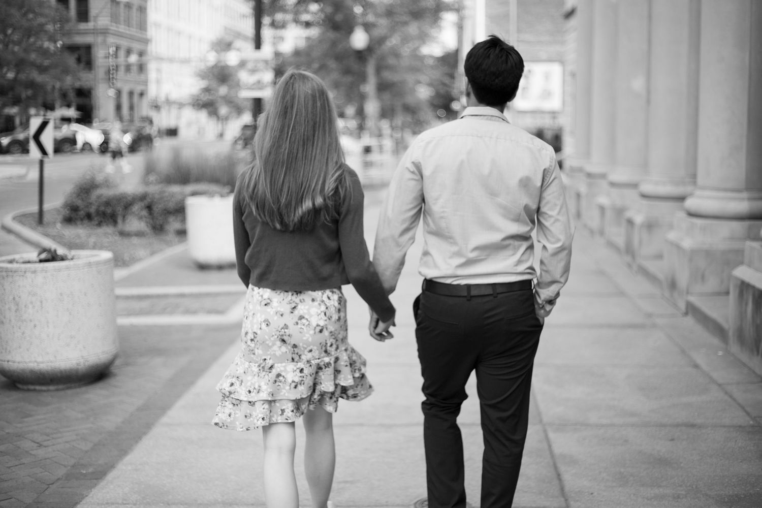 b&w photo - couple holding hands