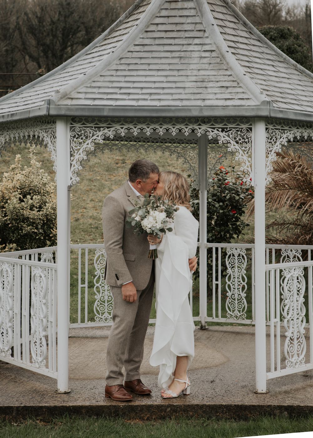 Bride and Groom walking in gardens at St Elizabeth's House Plympton