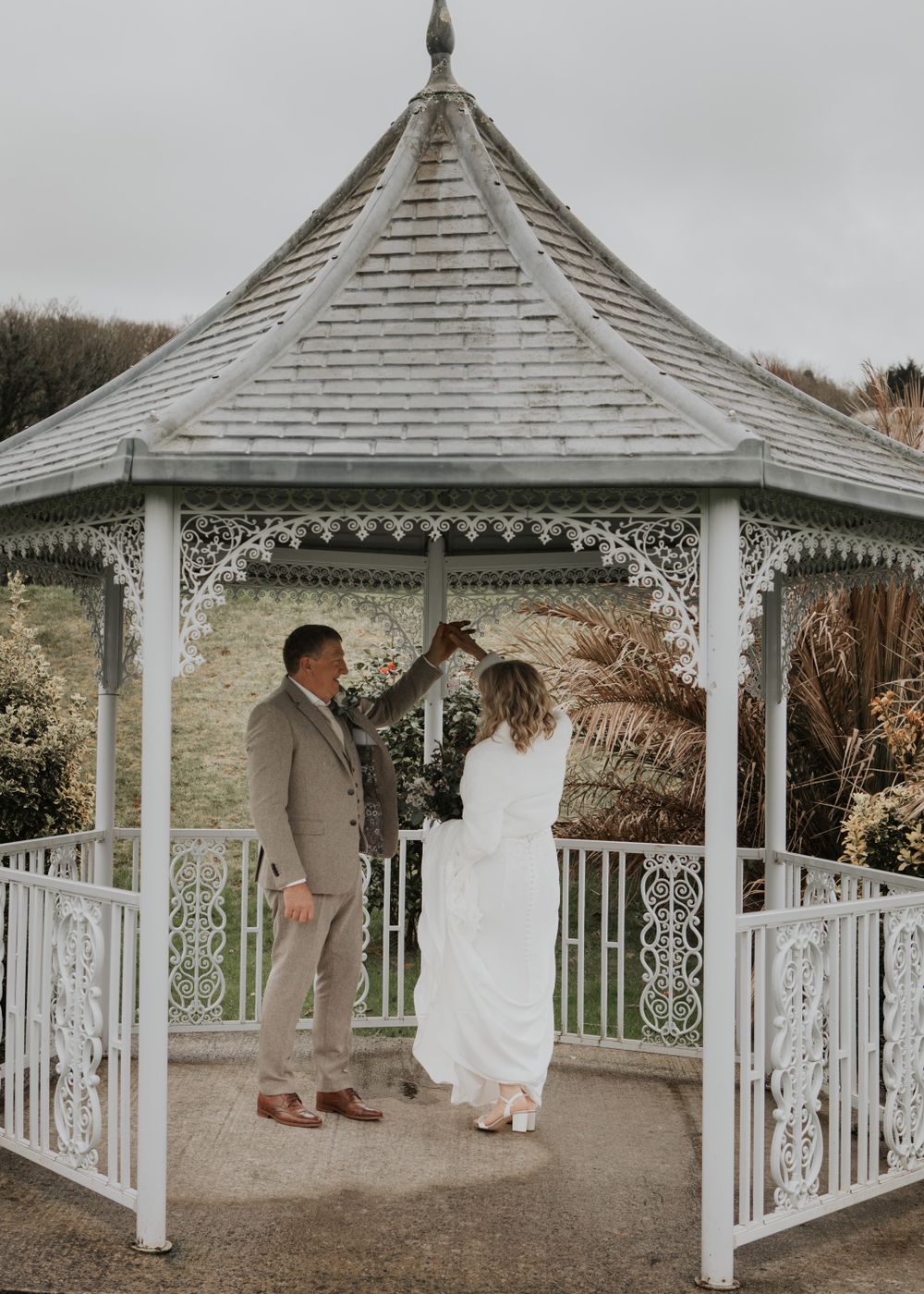Bride and Groom stood in gardens at St Elizabeth's House in Plympton