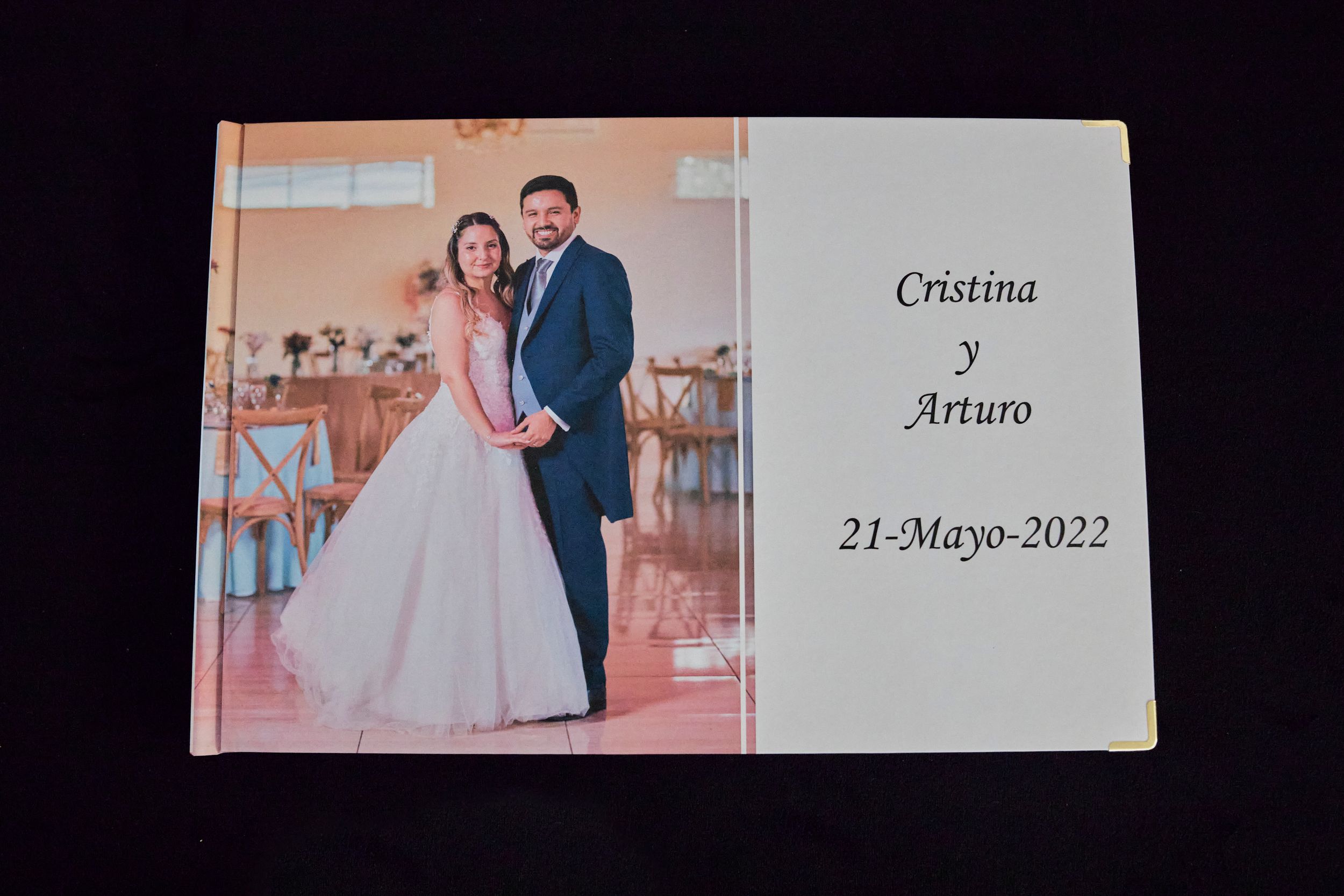 Wedding photo album cover showing a couple in traditional wedding attire with the date May 21, 2022.