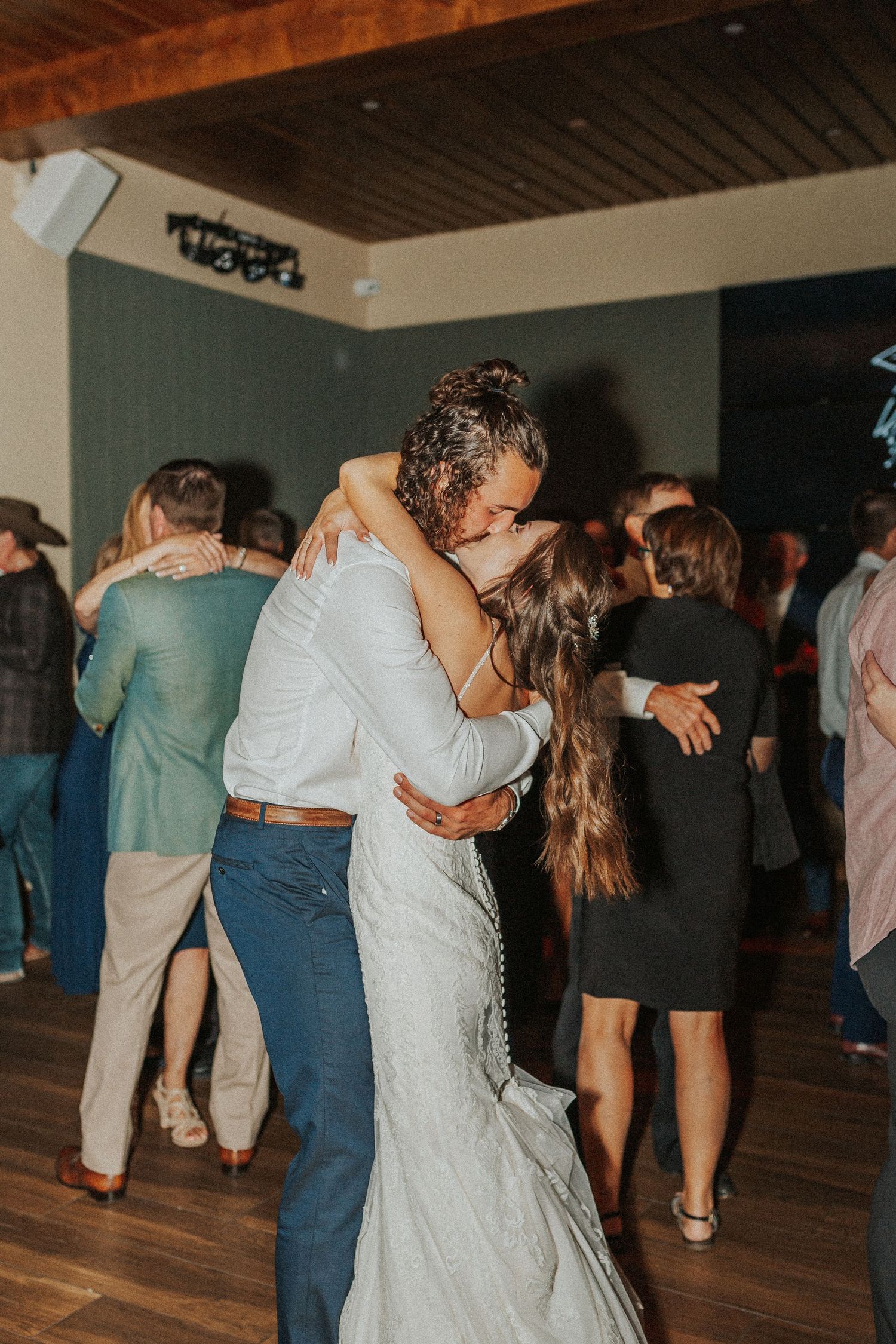 Bride and groom dancing and kissing Estes Park, CO