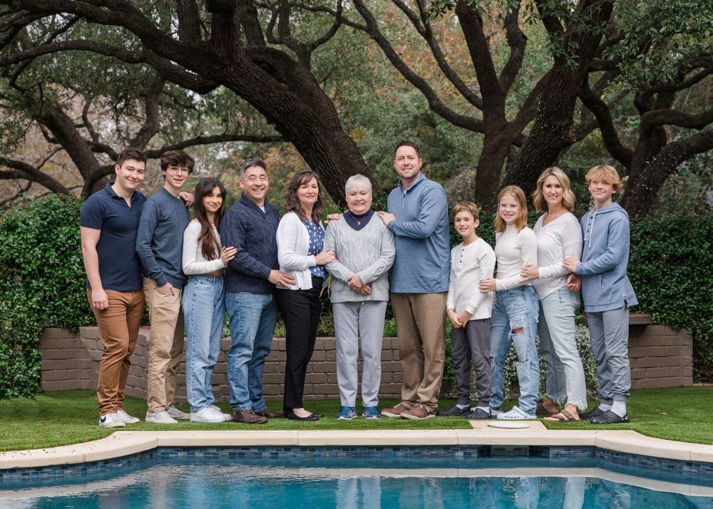 extended family photo standing by pool