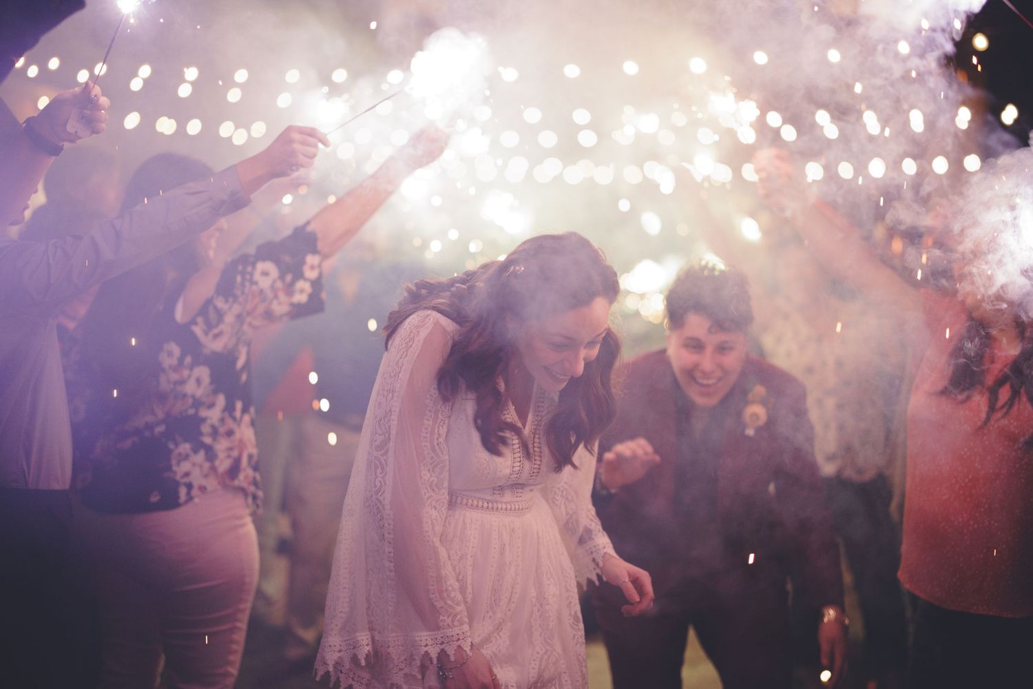 Married couple taking their sparkler exit