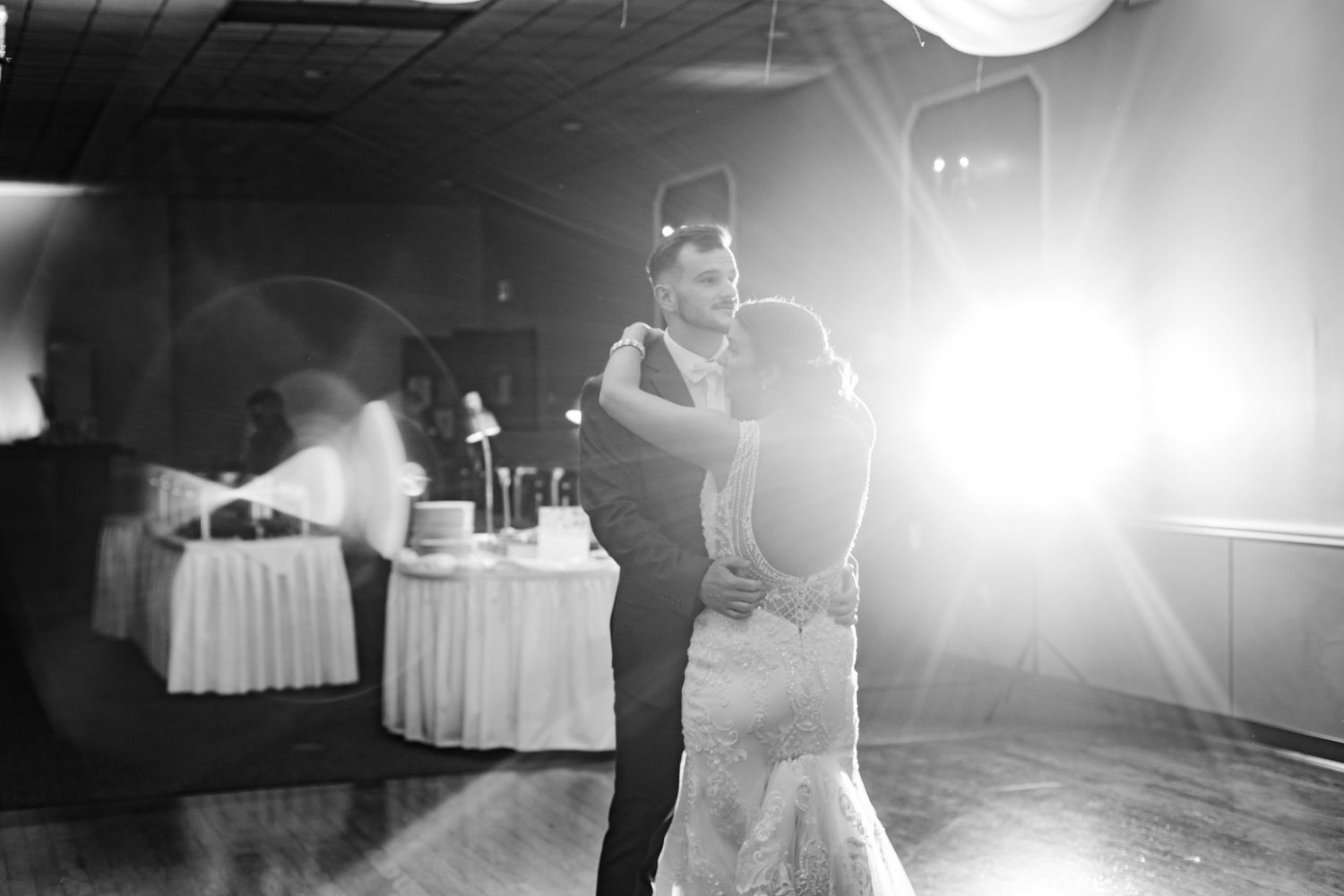 Black and white photo of couples dancing at a wedding reception.