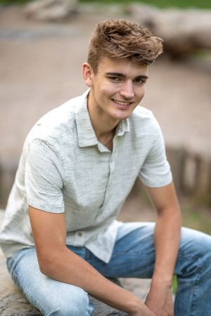 Casual outdoor portrait in soft natural lighting.