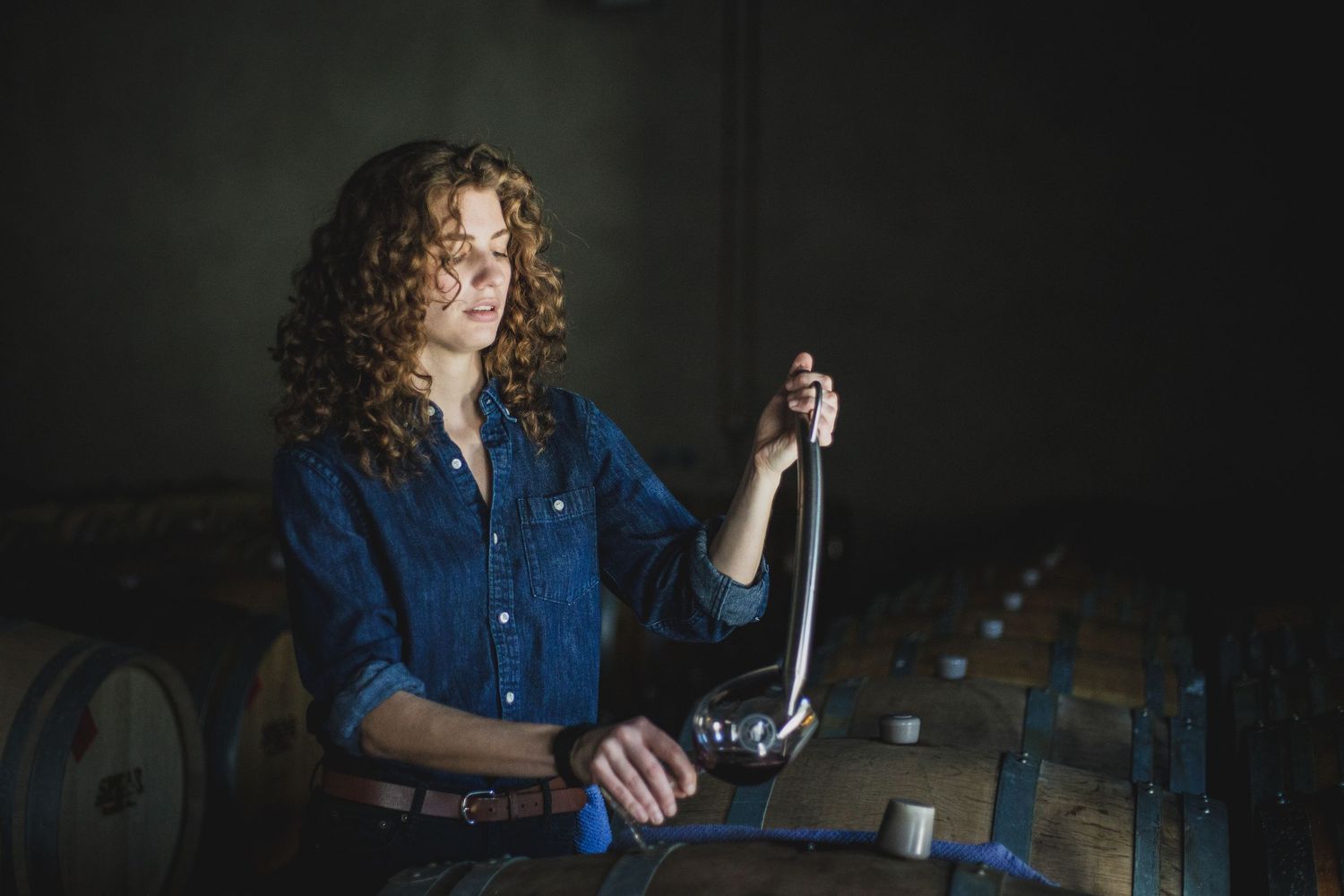Winemaker taking a barrel sample in Santa Barbara Wine Country