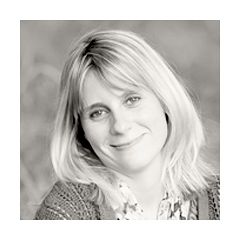 Professional black and white headshot portrait with soft natural lighting.