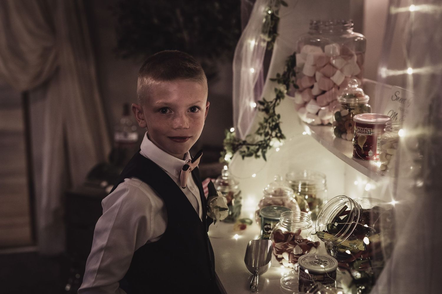 Page boy caught eying up the sweet cart at wedding in Wales