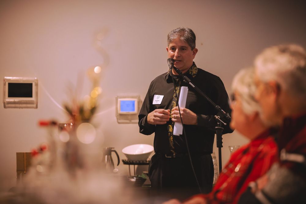 Someone addresses the crowd during a holiday gathering.