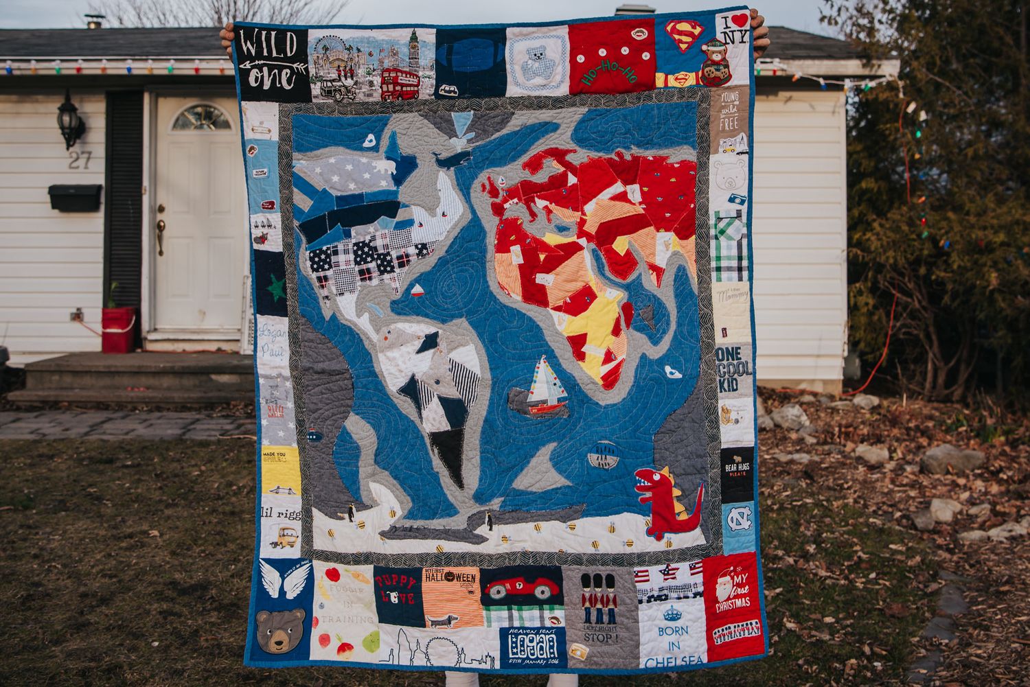 Memory quilt by This Splendid Chaos showing a map of the world and surrounded by a patchwork sashing.