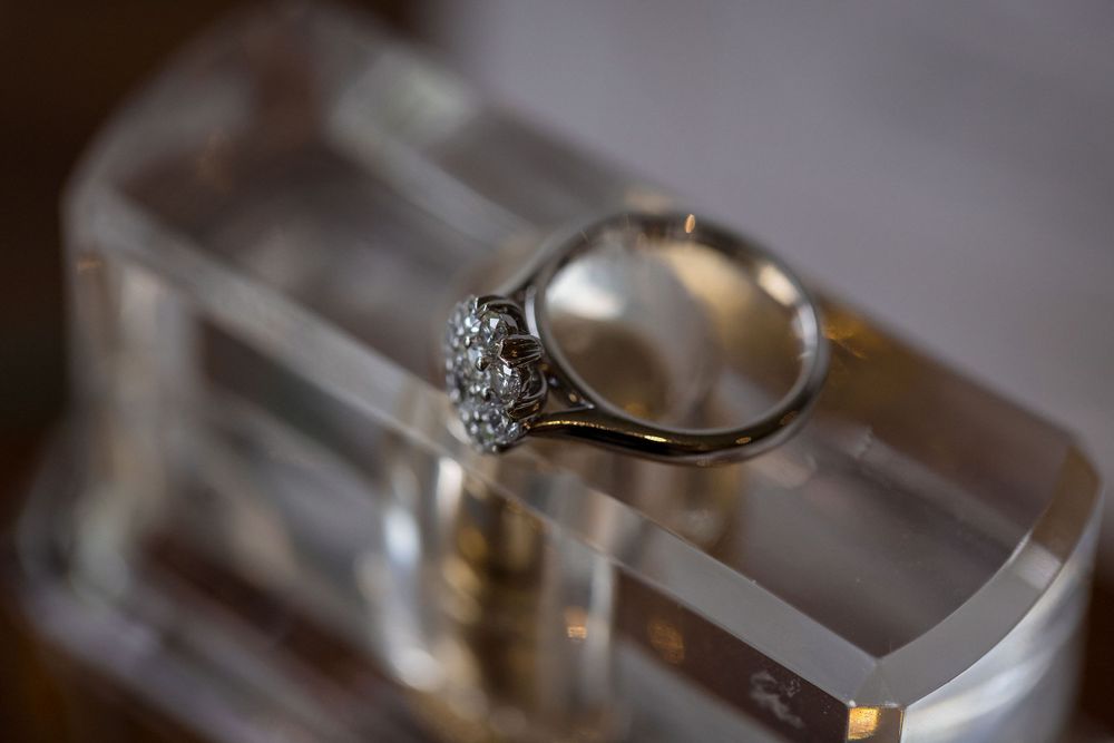 Brides Engagement ring on her bottle of perfume at Lancemore Milawa captured by Jason from Jason Robins Photography