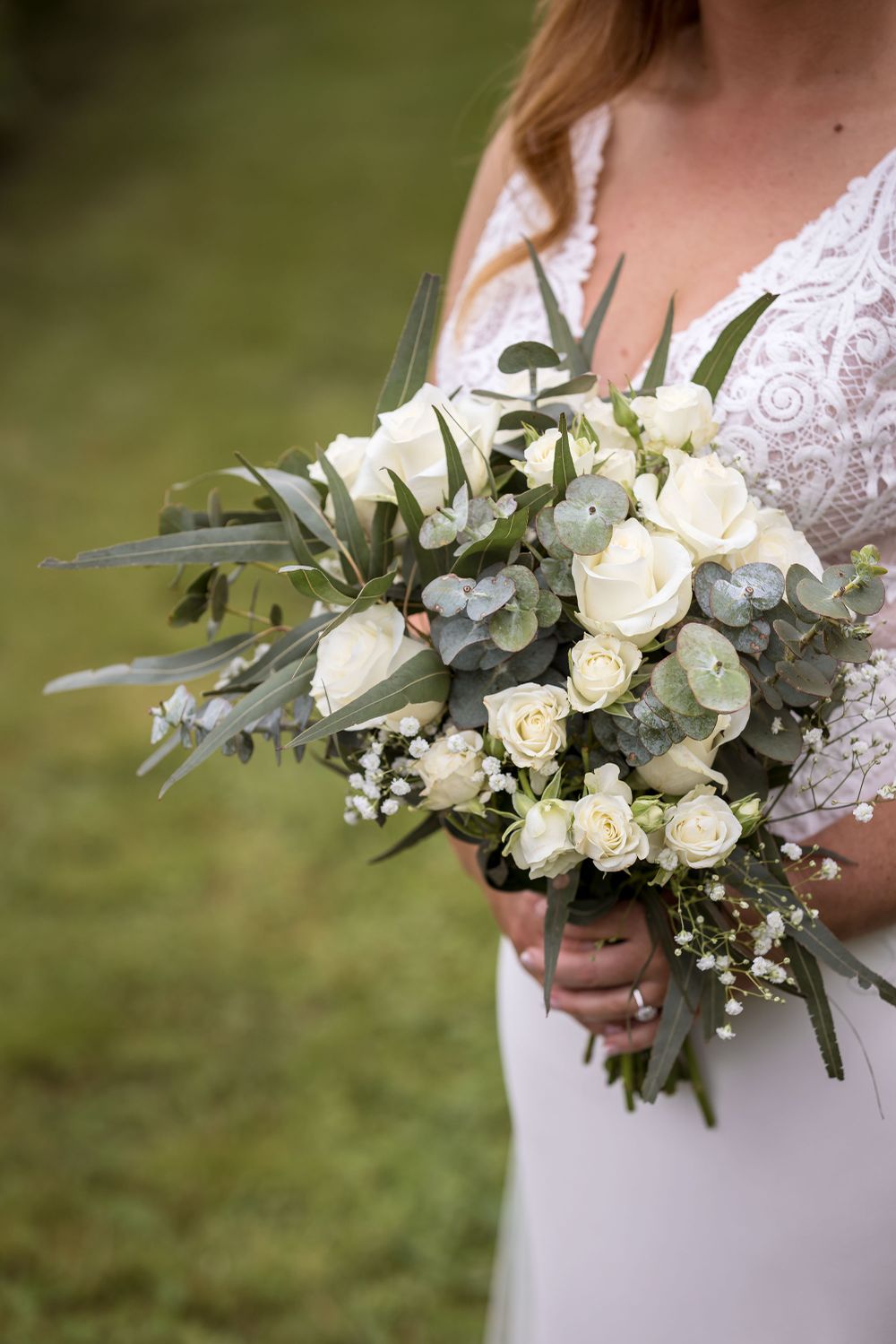 Bride in her wedding dress before her ceremony surrounded by grape vines, captured by Jason Robins Photography.
