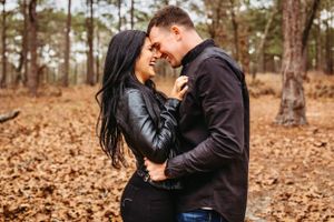 The vibrant colors of the forest make this couple's photo in New Haven, Connecticut pop with life