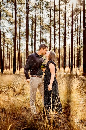 The soft, delicate colors of this couple's photo in a field create a whimsical feel in New Haven, Connecticut