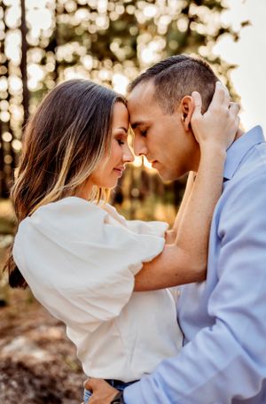 A dreamy photo of a couple embraced in a flower-filled field in New Haven, Connecticut