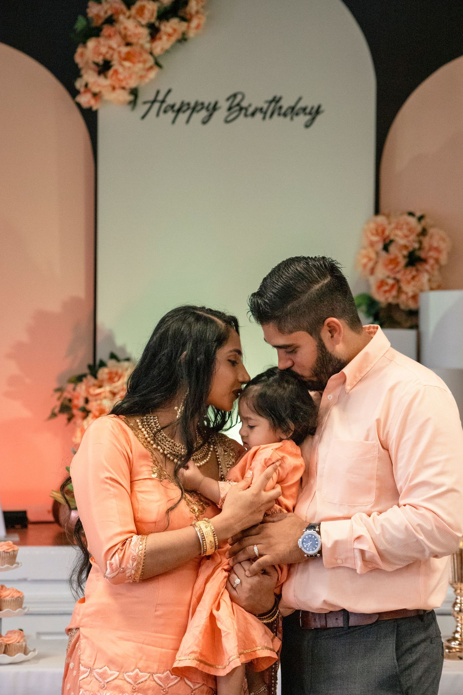 Family of 3 at one year olds birthday