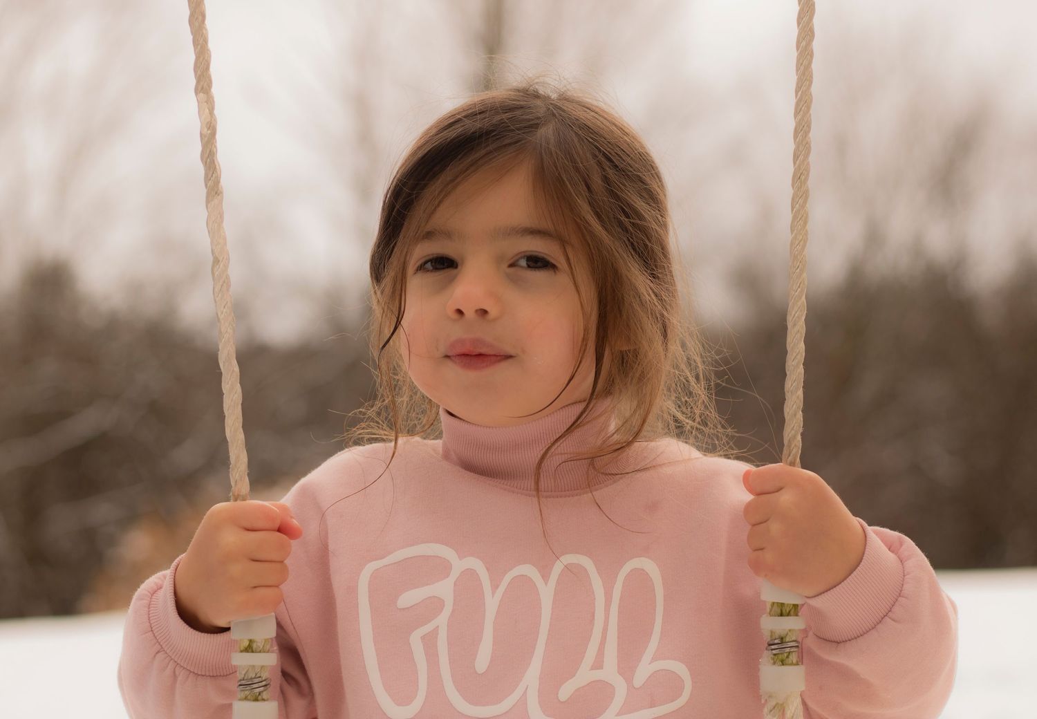 A preschooler on a swing