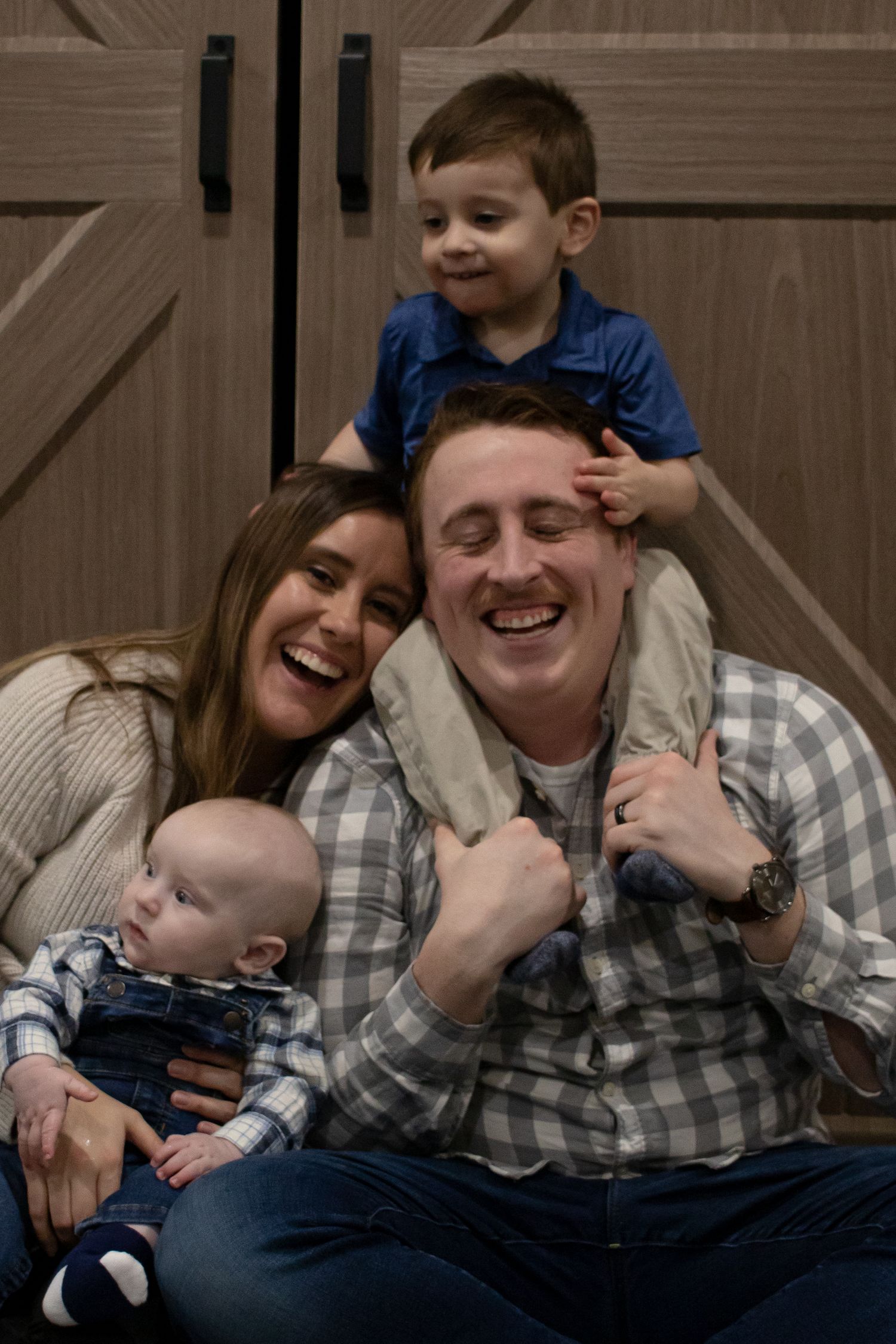 A family laughing in the basement