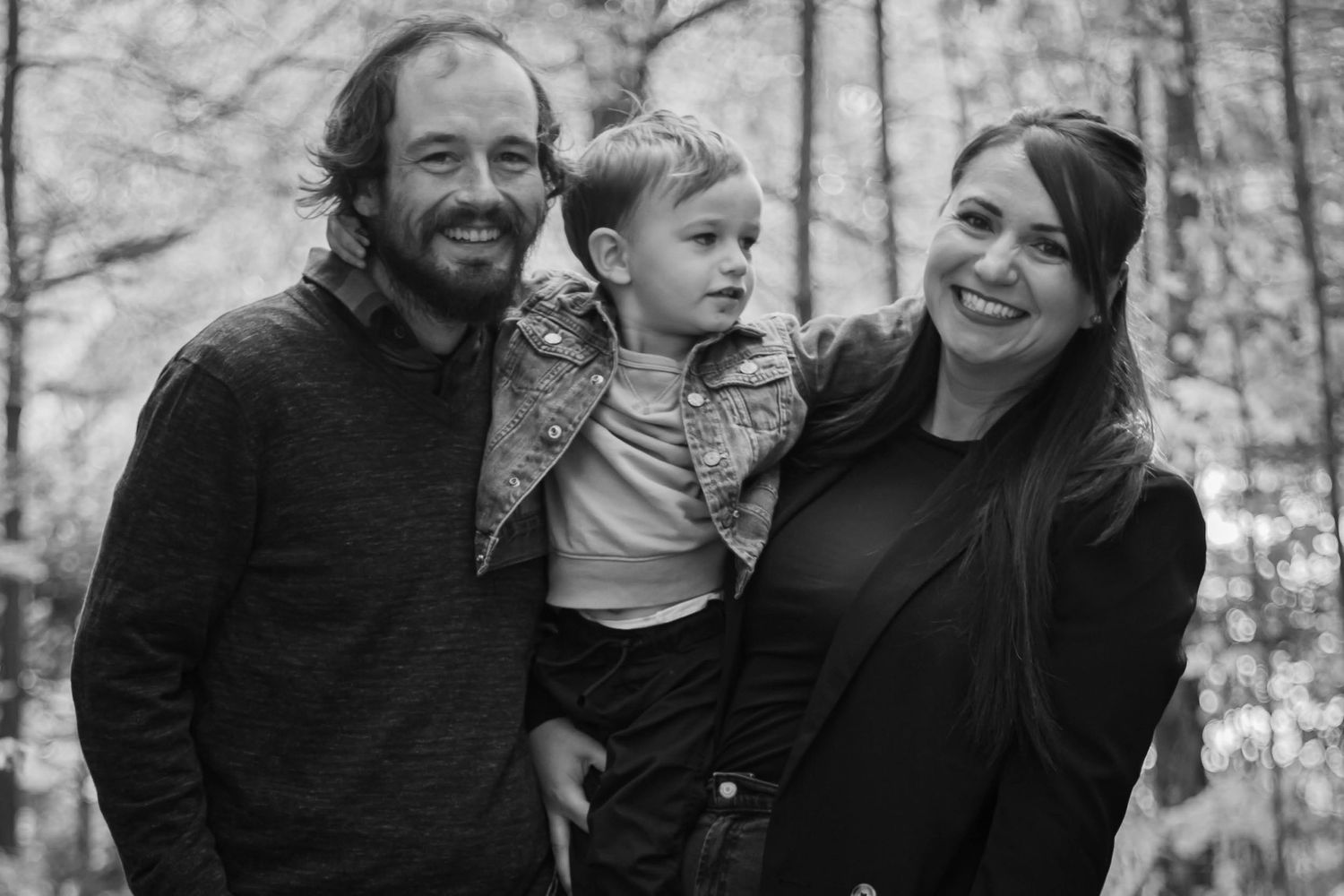 Black and white photo of family of 3