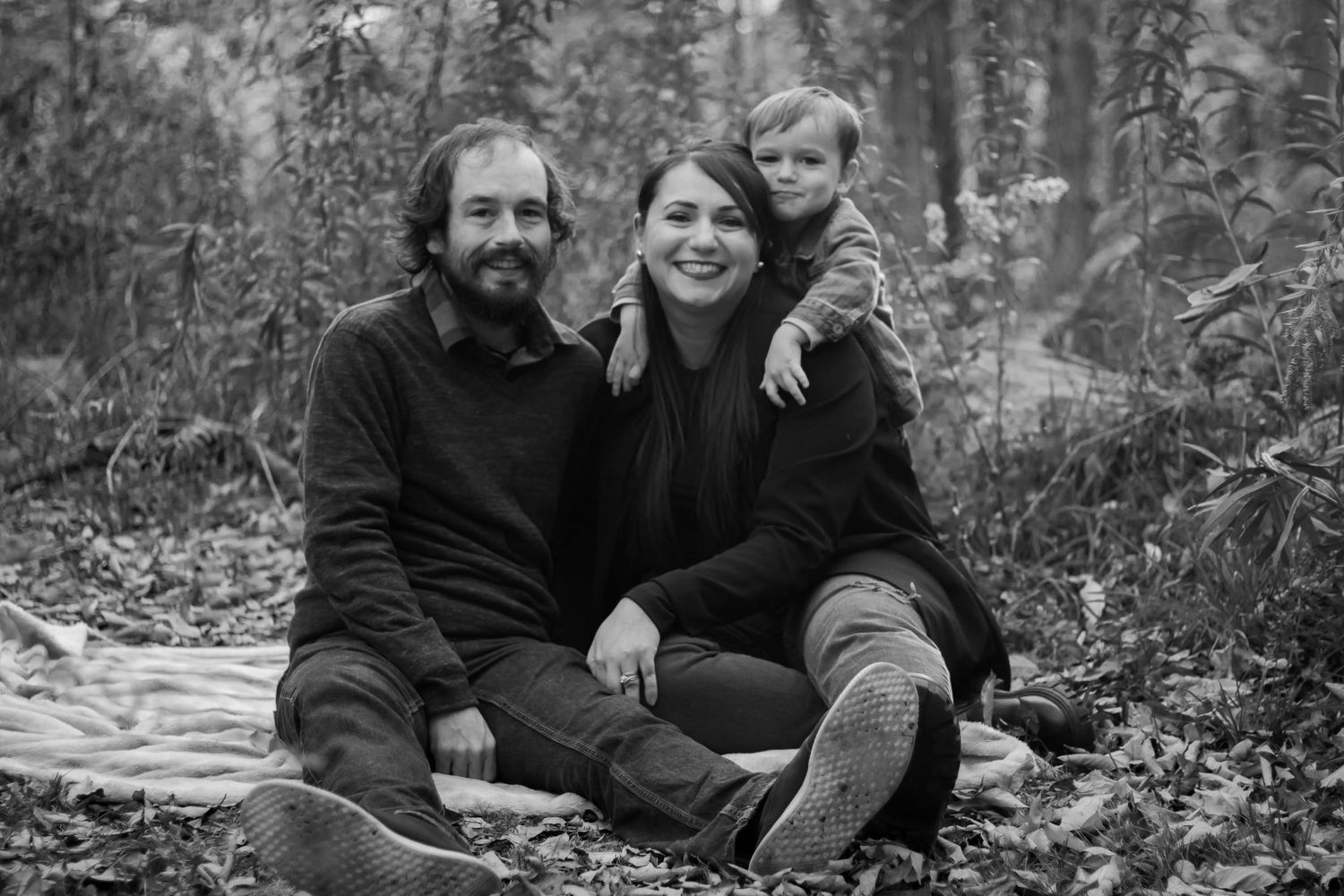 Black and white photo of family of 3