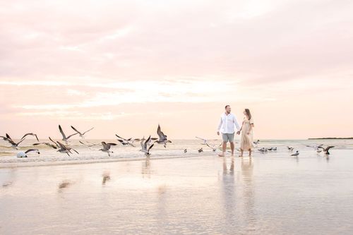 maternity photo of couple at beach sunset for a photography portfolio